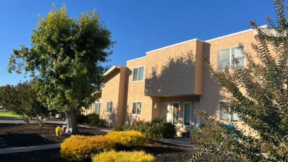 Street view of townhomes finished in smooth tan stucco — residential stucco contractor in the North Bay