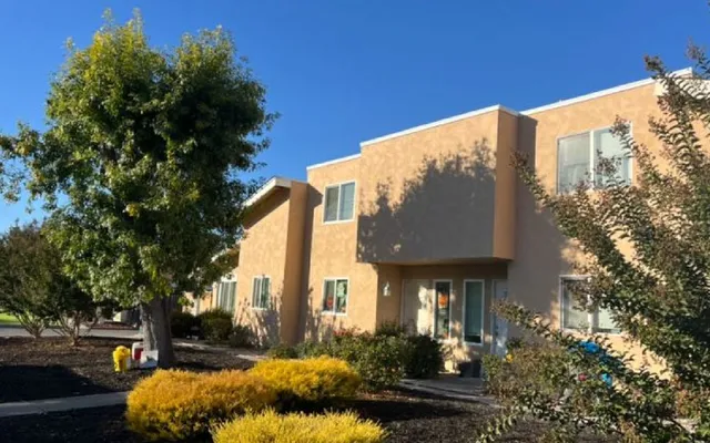 Street view of townhomes finished in smooth tan stucco — residential stucco contractor in the North Bay